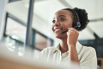 Image showing Black woman, call center and phone consultation with a smile in a office with contact us work. Telemarketing, consulting job and African female employee with communication and customer service