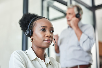 Image showing Business woman, call center and telemarketing work of a web support worker with consulting in office. Contact us, African female employee and phone consultation in a office with workforce team