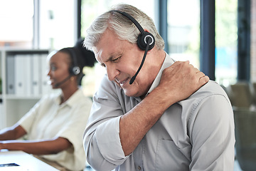 Image showing Stress, callcenter and man with shoulder pain in customer service agency, senior manager with crisis. Communication, management with injury or fatigue, help desk consultant with problem on phone call