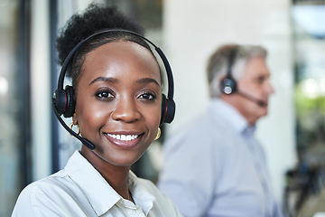 Image showing Black woman, face and call center work of a employee with telemarketing and contact us job. Phone consultation, African female person and web support in office with staff working on online consulting