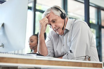 Image showing Stress, callcenter manager and man with headache in customer service agency with pain or crisis. Communication fail, senior management with computer or help desk consultant with problem on phone call