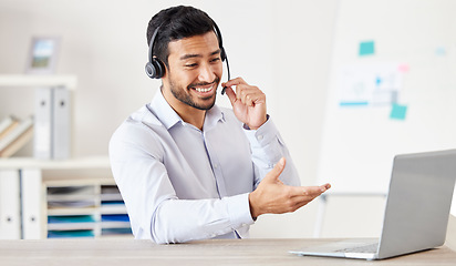 Image showing Consultant, man with a headset and laptop at his desk of a modern office workplace. Telemarketing or customer service, crm or online communication and male call center agent happy at workstation