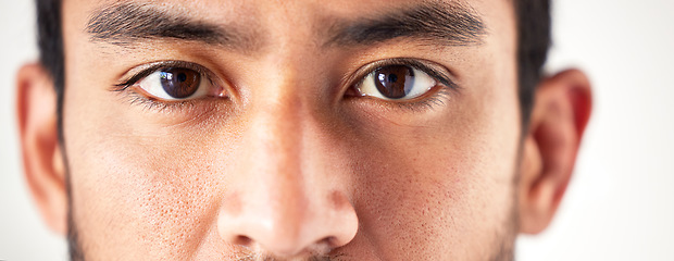 Image showing Closeup, portrait and man with eyes, vision and looking forward with sight, see and clear optics. Face, male person or model with eyesight, zoom or eyecare with health, wellness or staring with focus