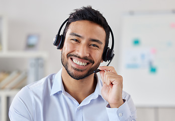 Image showing Portrait, call center and Asian man smile for telemarketing, customer service or technical support. Face, contact us and sales agent, crm consultant and person from Singapore working at help desk.