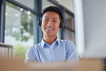 Image showing Call center, smile and portrait of business man in office for consulting, contact us and telemarketing. Communication, customer service and help desk with Asian employee for receptionist and advice