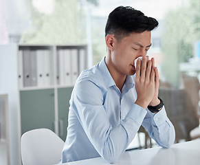 Image showing Allergy, blowing nose and virus with asian man in office for illness, influenza and sick. Sneeze, bacteria and disease with male employee and tissue in corporate business for allergies and congestion