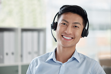 Image showing Asian man, call center and portrait smile with headphones in customer service, telemarketing or support at office. Face of happy male person or consultant agent smiling for online advice at workplace