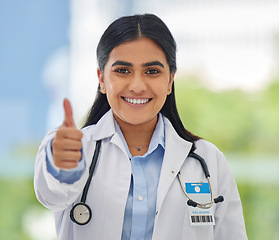 Image showing Woman, doctor portrait and thumbs up with hospital success, motivation and yes in clinic. Emoji, winner and like hand sign of a professional healthcare and wellness worker feeling happy from job