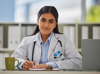 Image showing Medical, focus and portrait of doctor in office for consulting, report and paperwork. Medicine, healthcare and checklist with woman writing in hospital for prescription, wellness exam and results