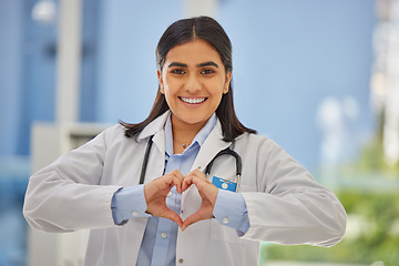 Image showing Doctor, heart hands and portrait of woman in hospital with support, kindness and trust in healthcare. Health care, insurance and female medical professional with love hand gesture or emoji in clinic.