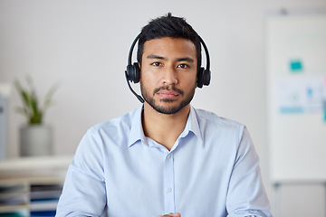 Image showing Serious portrait of man in call center, headset and help at customer service agency or sales desk. Telemarketing, communication and virtual assistant, businessman with focus, support and headphones.