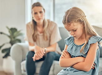 Image showing Angry mom, sad child and discipline in living room, frustration and problem with naughty girl behaviour in home. Scolding, punishment and frustrated mother, stubborn kid and communication with anger.