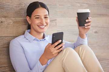 Image showing Businesswoman on floor with phone, smile and coffee break browsing internet, social media meme or texting. Happy woman, paper cup and cellphone, relax and checking online post or good news in office.