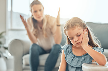 Image showing Angry lecture from mother, sad child and problem with discipline in living room, naughty girl behavior in home. Scolding, punishment and frustrated woman, stubborn kid and communication with anger.