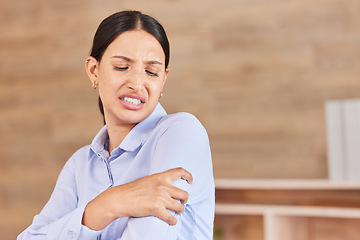 Image showing Business woman, arm pain and stress with sore shoulder, broken bone or discomfort at office. Frustrated and tired female person or employee holding painful area, inflammation or joint at workplace
