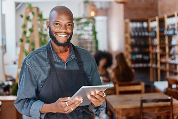 Image showing Restaurant, tablet and portrait of man or small business owner, e commerce and cafe or coffee shop management. Happy waiter or african person with sales on digital technology or internet for startup