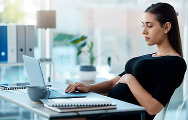 Image showing Business woman, pregnancy and typing in office with laptop, search or project in finance company. Pregnant businesswoman, accounting and computer at desk with planning, schedule and touching stomach