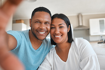 Image showing Young couple, home and selfie with smile, happiness and love with post, social media app and portrait together. Man, woman and happy with photography, profile picture and internet blog in house