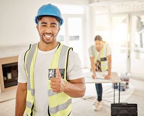 Image showing Portrait of man, construction and home renovation with thumbs up, helmet and smile in apartment. Yes, positive mindset and diy renovations, happy handyman in safety and building project in new house.