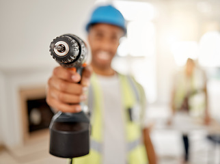 Image showing Engineer, handyman and drill in hand of a man for maintenance or carpenter work. Male construction worker, constructor or contractor with electric power tools at building site for renovation mockup