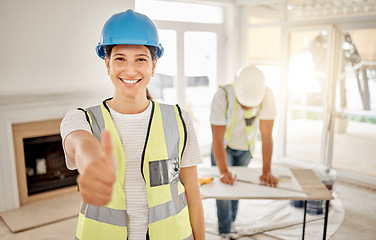 Image showing Portrait of woman, construction and home renovation with thumbs up, helmet and smile in apartment. Yes, positive mindset and diy renovations, happy female in safety and building project in new house.