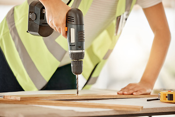 Image showing Wood, construction and carpenter hand with a drill for repair, renovation or building. Hands of contractor, carpenter or technician person with electric power tools for furniture project in workshop