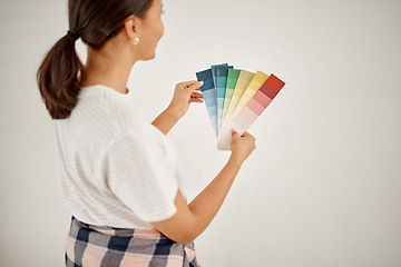 Image showing Renovation, woman and wall colours with chart at home with creativity for interior design. Female designer, thinking and colour card for paint for a house with guide for idea with maintenance.