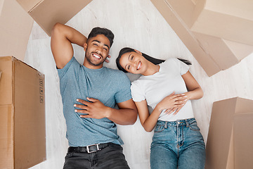 Image showing Top view, home and couple with boxes, ground and relationship with property, living room and apartment. Portrait, happy man or woman on the floor, cardboard and property with investment and new house