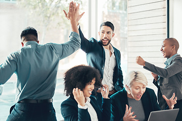 Image showing High five, colleagues celebrating and at office of their workplace with a lens flare together. Success or achievement, happy and diverse coworkers support or with celebration at their workspace