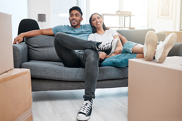 Image showing Homeowners, relax and couple on a sofa, boxes and real estate with property, living room and moving in. Relationship, woman and man on a couch, love and mortgage with happiness, marriage or cardboard