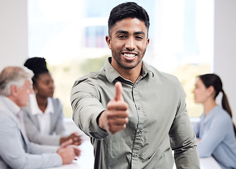 Image showing Portrait, smile and a business man thumbs up in the boardroom with his team planning in the background. Leadership, workshop and motivation with a happy young male employee standing in the office