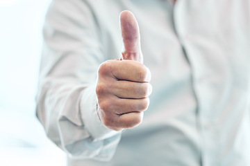 Image showing Businessman, hand and thumbs up for winning, approval or corporate success at the office. Hands of man with thumb emoji, yes sign or like for achievement, agreement or thank you at the workplace