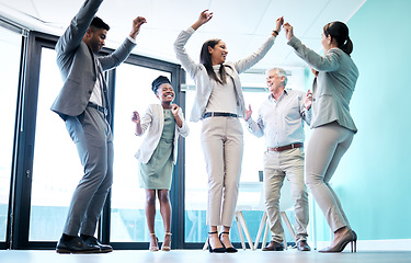 Image showing Business people, diversity and dancing in office for team building, celebration or corporate event. Happy group of employees dance in fun teamwork, collaboration or winning together at the workplace