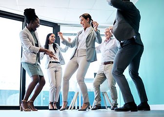 Image showing Business people, diversity and dancing for team building, celebration or corporate event at office. Happy group of employees dance in fun teamwork, collaboration or winning together at the workplace