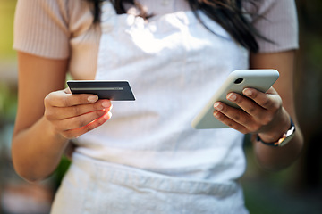 Image showing Woman hands, credit card and business owner phone with ecommerce, online shopping and digital payment. Outdoor, banking app and female employee hand with mobile connectivity on web for purchase