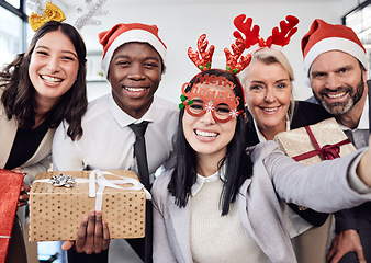 Image showing Friends, selfie and business people at christmas party in the office with silly accessories. Diversity, smile and happy corporate colleagues taking picture together with gifts at festive celebration.