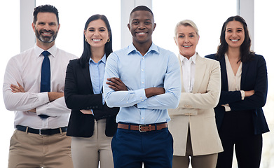 Image showing Portrait, leadership and arms crossed with a business team standing together in their professional office. Collaboration, teamwork and management with a group of colleagues looking confident at work