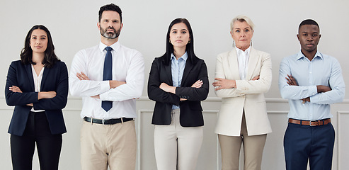 Image showing Portrait, professional and arms crossed with a business team standing together in a corporate office. Collaboration, teamwork and management with a group of serious people looking confident at work