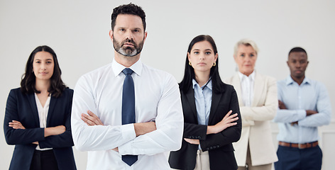 Image showing Portrait, leadership and a business man arms crossed with his team in their professional office. Management, collaboration or teamwork with a male boss and colleagues looking confident together