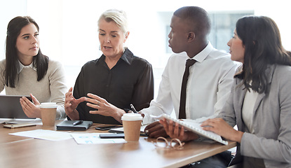 Image showing Business people, meeting and manager talking to a team in a corporate office for brainstorming. Diversity men and women at a table for planning, discussion and strategy for growth and development
