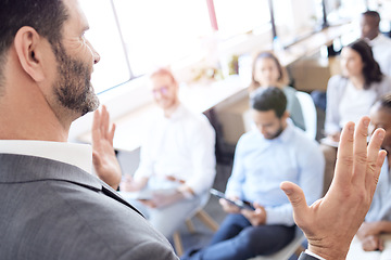 Image showing Presentation, speaker hands and business people in audience at a conference, seminar or corporate workshop. Professional presenter man talk or speech for crowd at convention, training or trade show