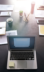 Image showing Laptop, presentation and planning with a table in an empty boardroom ready for a strategy meeting. Computer, flare and still life with technology in a professional office for finance or accounting