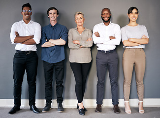 Image showing Group portrait, business people and arms crossed by wall with teamwork, smile and diversity at insurance agency. Men, women and together with happiness for team building, solidarity and collaboration