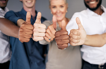Image showing Group closeup, thumbs up and hands for business people by wall with emoji, diversity and insurance agency. Men, women and goal with smile for team building, solidarity and collaboration in portrait