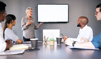 Image showing Senior woman, meeting and coaching on mockup in presentation for team strategy or project management at office. Mature female person, coach or CEO mentor training staff on mock up screen at workplace