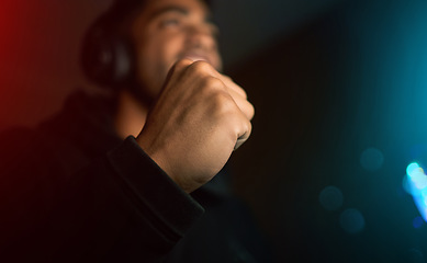 Image showing Fist pump, man win video game and celebration with live online streaming, gaming competition and esports. Dark room, cyber and male streamer hand and celebrate winning gamer tournament with success