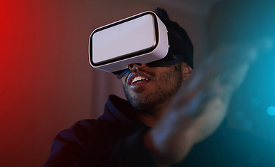 Image showing Man in dark room, video game and VR goggles, online streaming with gaming, metaverse and esports. Neon, cyber space with male streamer and future technology with games and virtual reality simulation