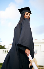 Image showing Portrait, certificate and back with a woman graduate on university campus for a celebration event outdoor. Graduation, education and future with a happy young female student alone outside at college