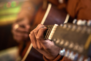 Image showing Studio, musician and guitar in a closeup with hands for performance with talent for production. Acoustic, instrument and male artist with learning, skills with creativity for track with sound.