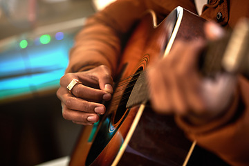 Image showing Guitar, hands and man in a studio with a closeup for production with musician and creativity. Artist, playing and acoustic instrument with hand for performance with audio and skills at the house.